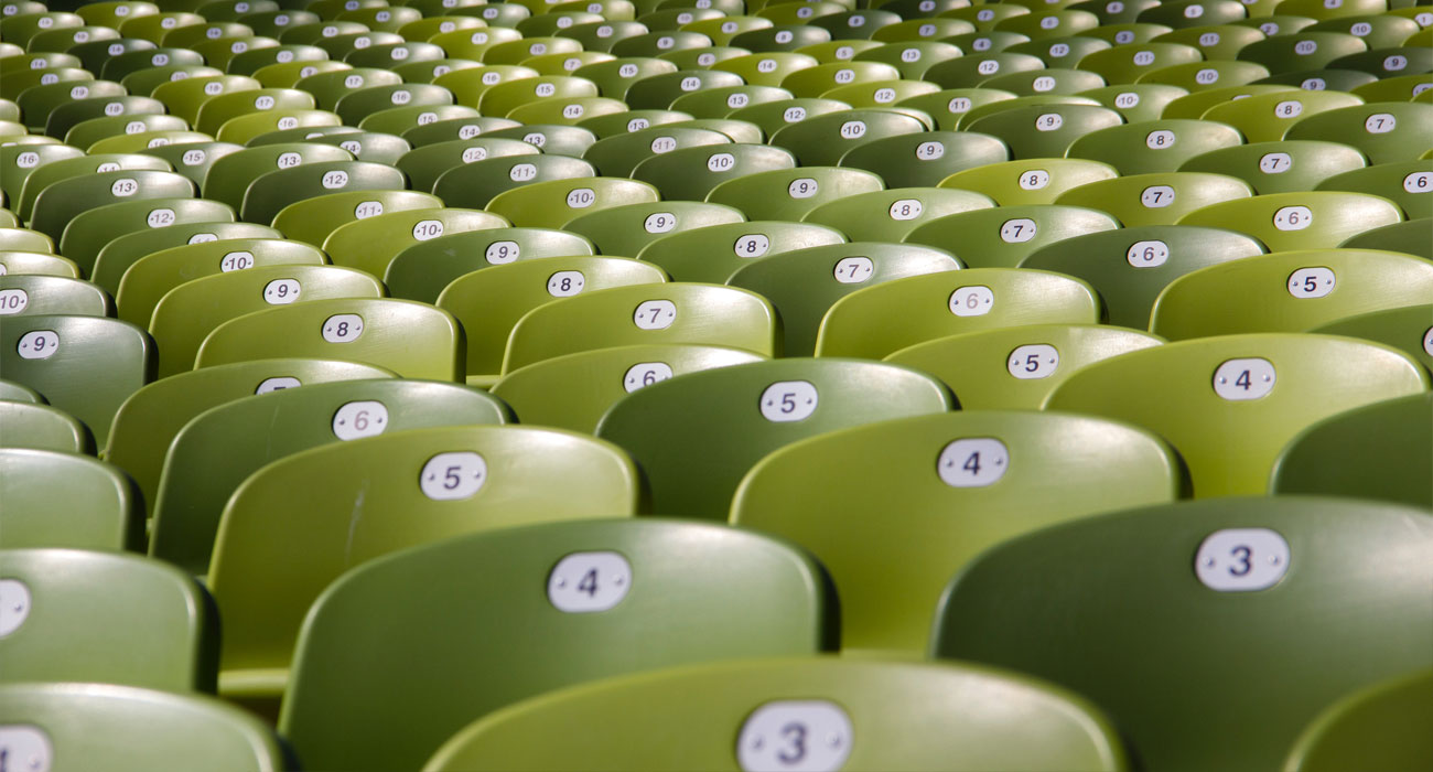 Back of chairs with numbers in green